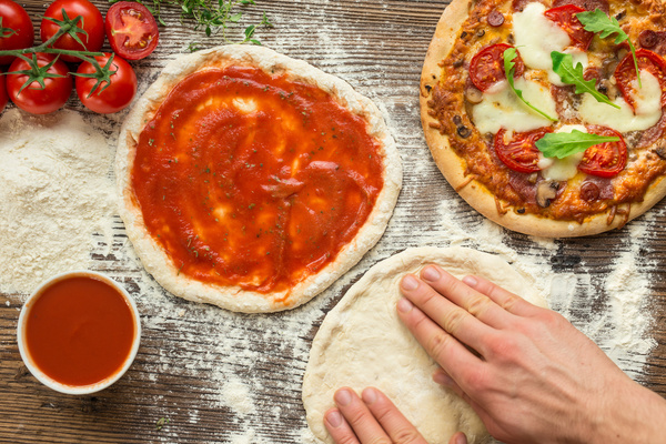 Homemade delicious pizzas with tomato sauce Stock Photo