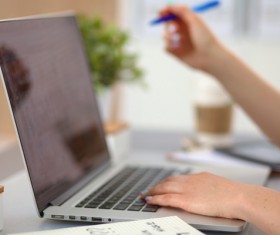 Laptop information for business ladies Stock Photo