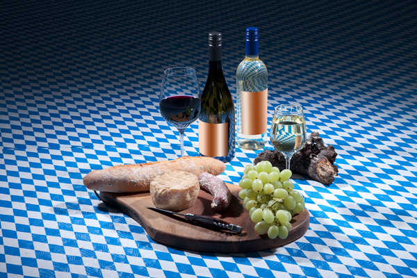 Lattice tablecloth wines and cheese Stock Photo