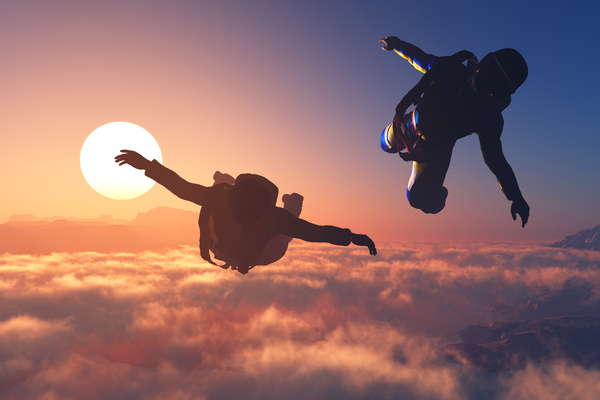 Limit skydiving with the fiery red sun Stock Photo