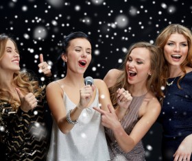 New Year Karaoke singing women Stock Photo