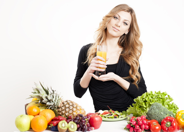 Nutrition Healthy woman with vegetables and vegetable juice in hand 01