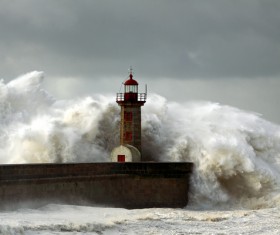 Rough wave pier Lighthouse Stock Photo