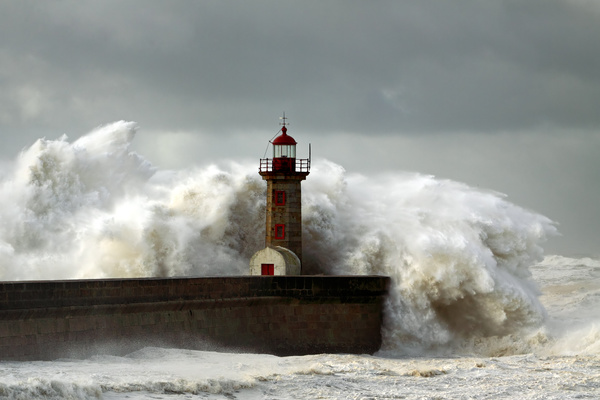 Rough wave pier Lighthouse Stock Photo