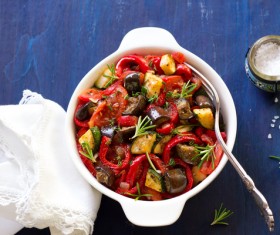 Salt shaker on the table with delicious stew Stock Photo