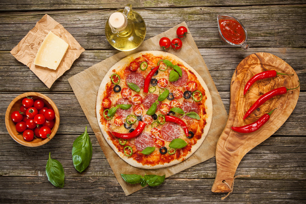 Spicy pizza with tomato olive oil Stock Photo