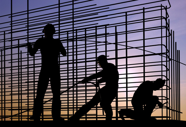 Sunset under the construction worker Stock Photo