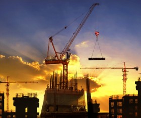 Sunset under the crane Stock Photo