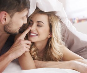 Sweet couple in the quilt Stock Photo