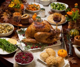 Thanksgiving dinner table rich roast turkey red wine and all kinds of vegetables