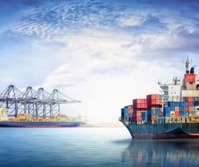 The docked cargo ship and the freighter in the voyage