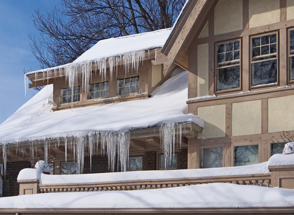 The roof covered with snow and icicles