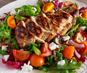 The vegetables are decorated with delicious grilled chicken