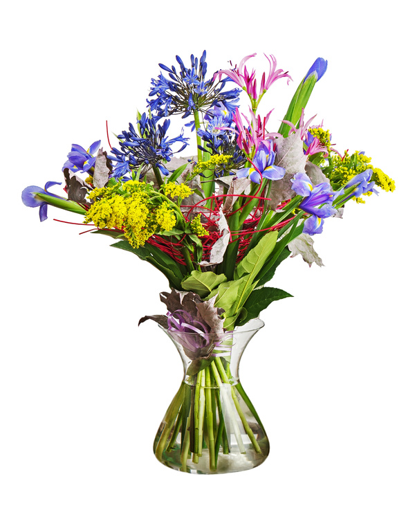 Transparent vase with colorful flowers Stock Photo