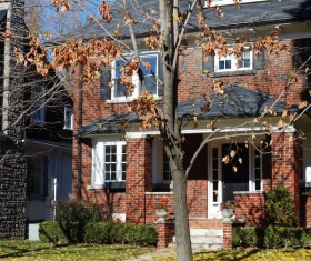 Typical British architecture with fallen leaves in autumn