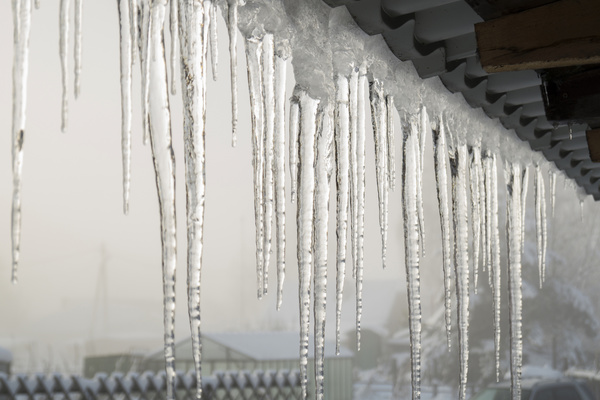 Under the eaves hanging icicles Stock Photo 03