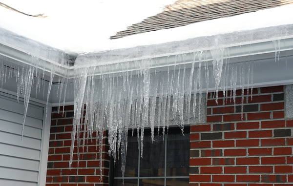 Under the eaves hanging icicles Stock Photo 05