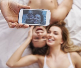 With the phone self-timer couple Stock Photo