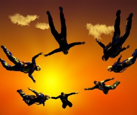 Yellow sun with skydiving athlete Stock Photo