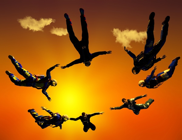 Yellow sun with skydiving athlete Stock Photo