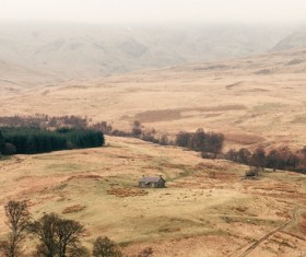 Barren hills hut Stock Photo