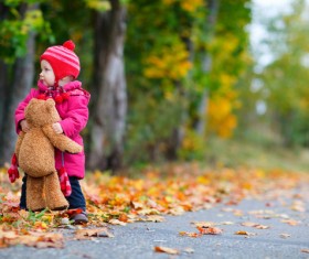 A little girl with a bear Stock Photo