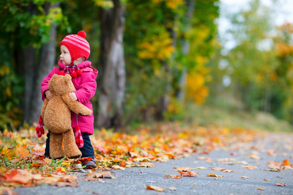 A little girl with a bear Stock Photo