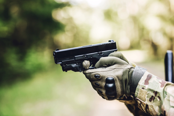 A soldier holding a pistol Stock Photo
