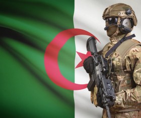 Algerian flag with armed soldiers Stock Photo