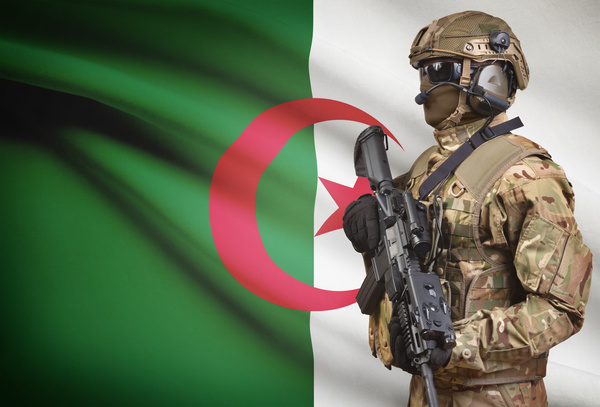 Algerian flag with armed soldiers Stock Photo