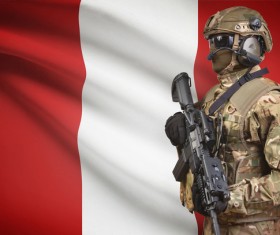 Austrian flag with heavily armed soldiers Stock Photo