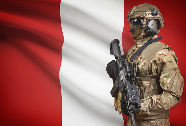 Austrian flag with heavily armed soldiers Stock Photo