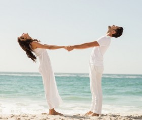 Beach Couple holding hands Stock Photo