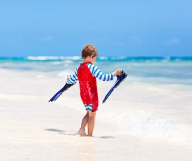 Beach boy with flippers Stock Photo 01
