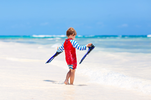 Beach boy with flippers Stock Photo 01