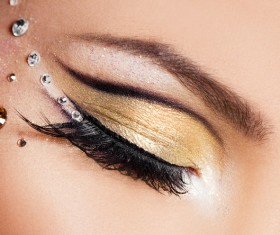 Beautiful woman with eyes, golden eye shadow Stock Photo 01