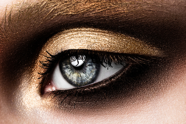 Beautiful woman with eyes, golden eye shadow Stock Photo 03