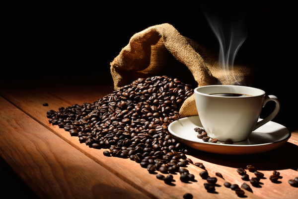Coffee on the table with coffee beans Stock Photo