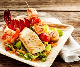 Delicious grilled shrimp, vegetables, skewers Stock Photo