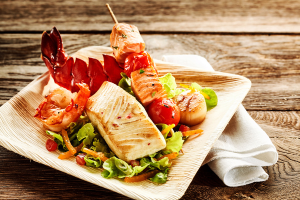 Delicious grilled shrimp, vegetables, skewers Stock Photo