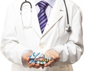 Doctor holding pill HD picture