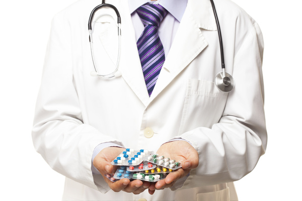 Doctor holding pill HD picture