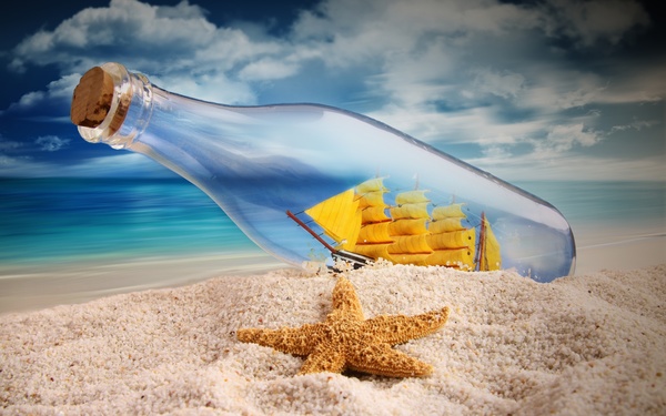 Drifting bottles on the beach Stock Photo