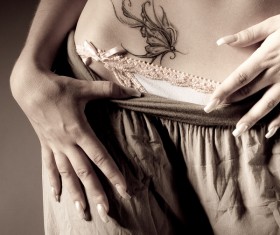 Female belly on butterfly tattoo HD picture