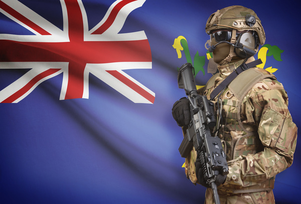 Flag of Fiji with heavily armed soldiers Stock Photo