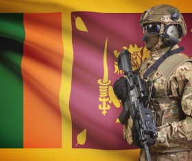 Flag of Sri Lanka with heavily armed soldiers Stock Photo