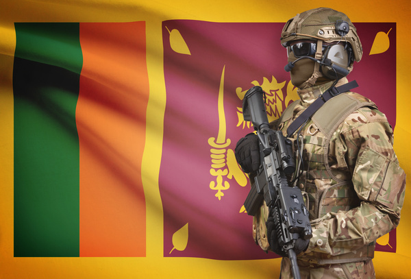 Flag of Sri Lanka with heavily armed soldiers Stock Photo