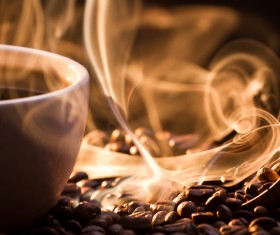 Fragrant hot coffee with coffee beans Stock Photo