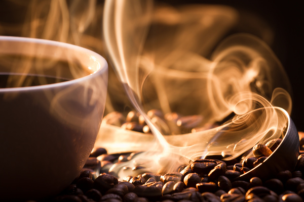 Fragrant hot coffee with coffee beans Stock Photo