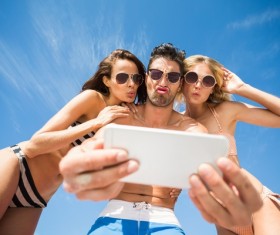 Funny self-timer with friends Stock Photo